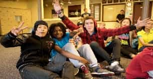 a group of people sitting on the floor