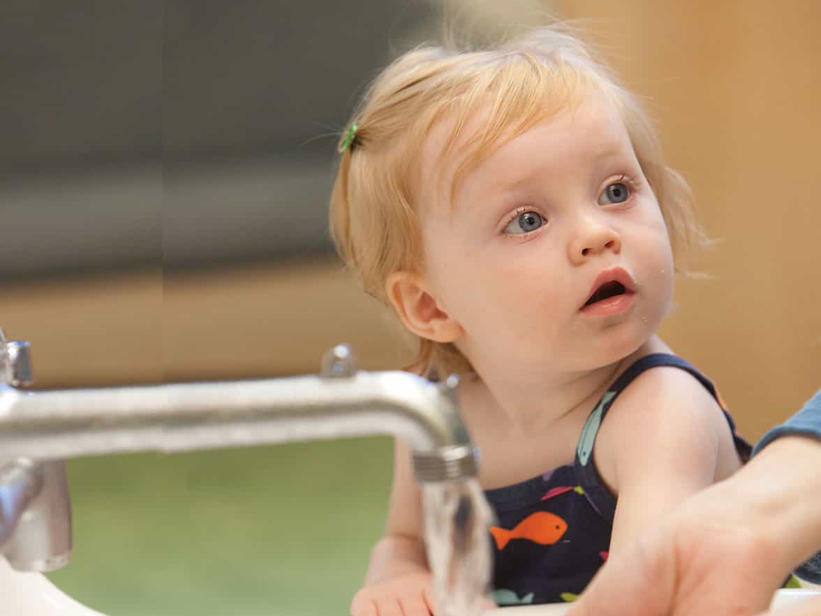 a baby looking at the camera