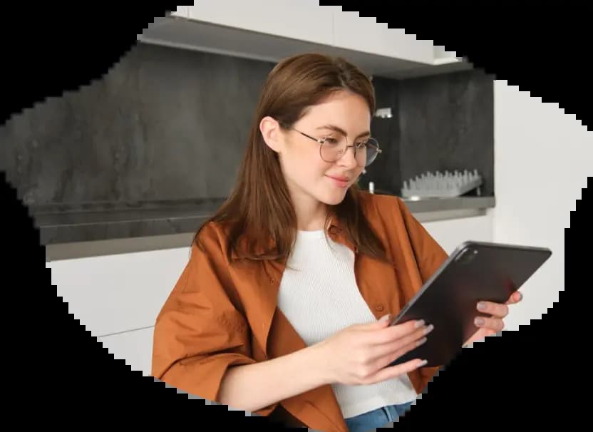 Woman in glasses reads book and smile