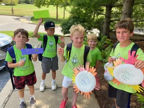 a group of kids holding frisbees