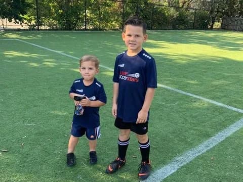 two boys on a football field