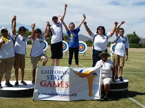 a group of people holding a sign