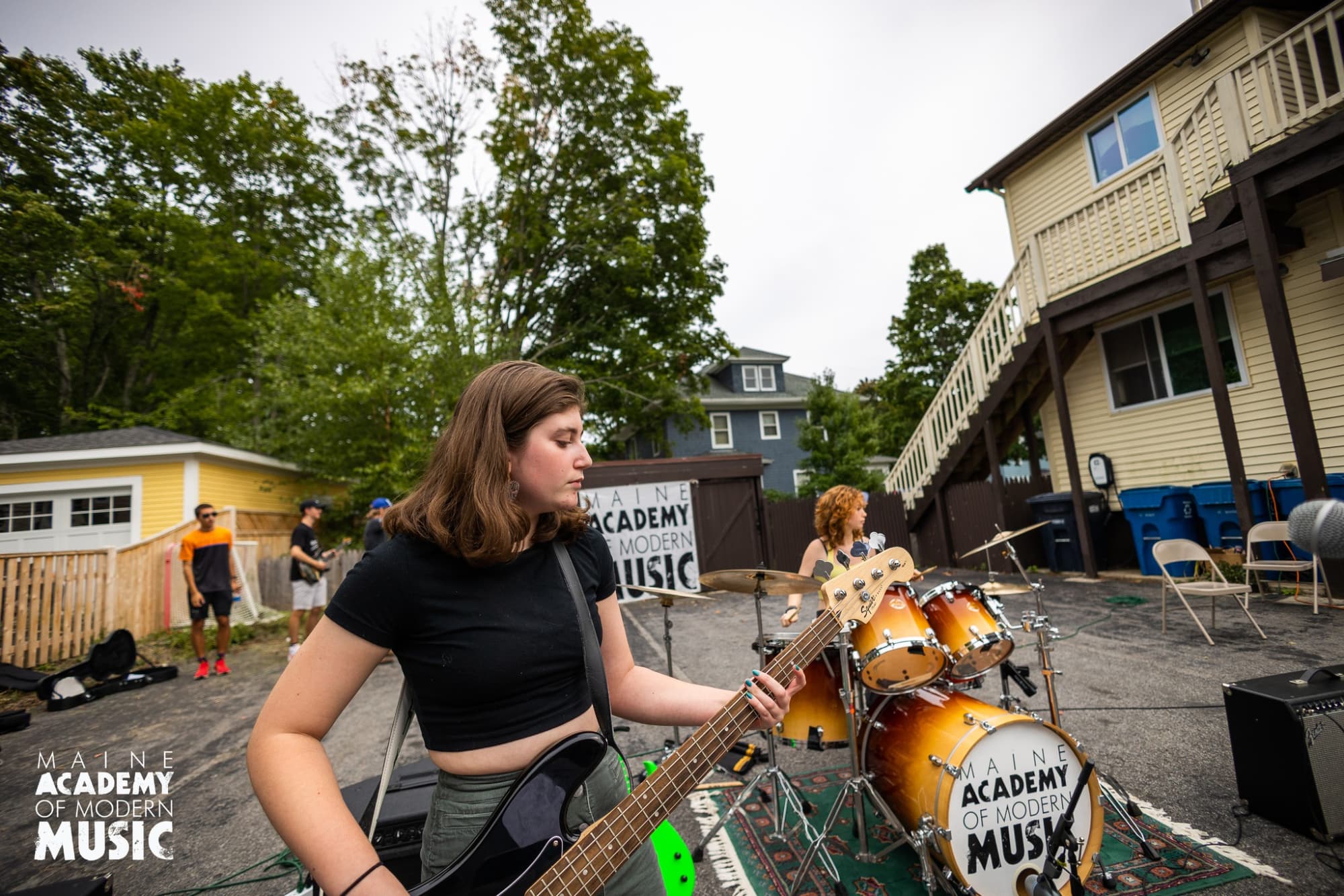 a woman playing a guitar