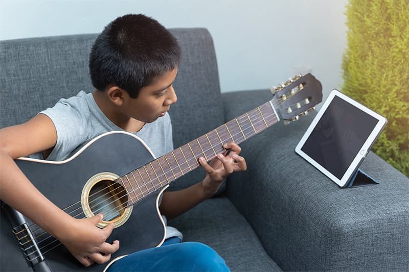 a person playing a guitar