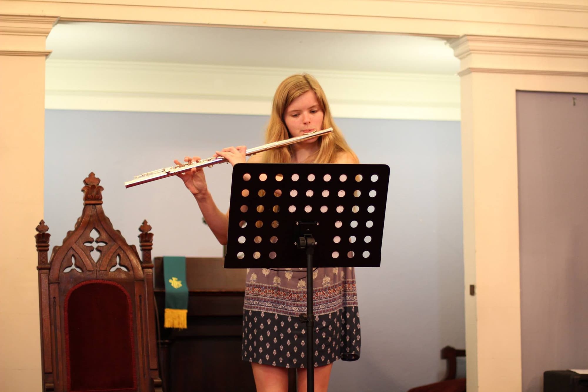 a woman holding a flute