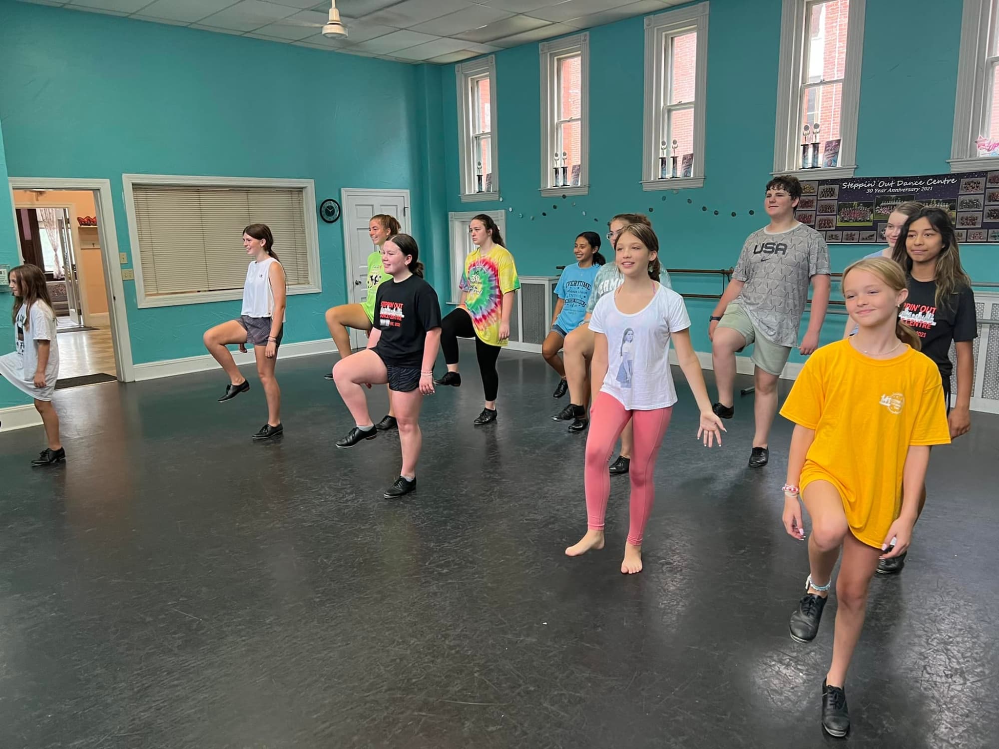a group of people dancing in a room