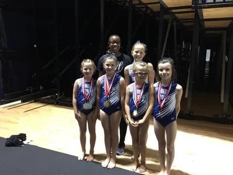 a group of people wearing medals