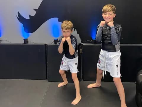 two boys standing on a stage