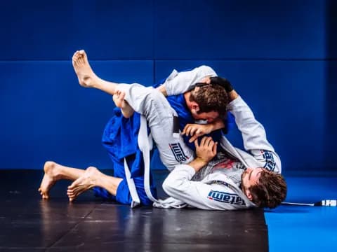a group of men in karate uniforms