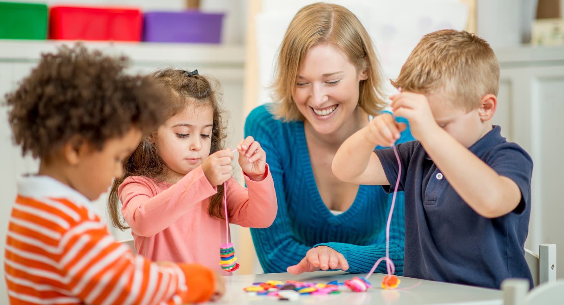 a person and children painting