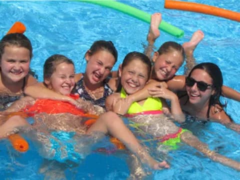 a group of people in a pool