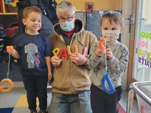 a person and two boys