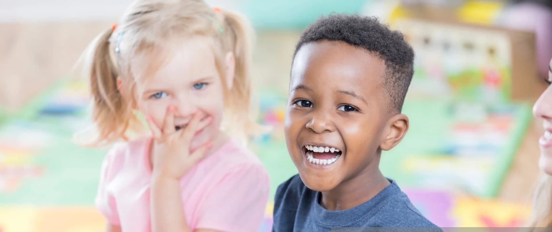 a couple of children smiling