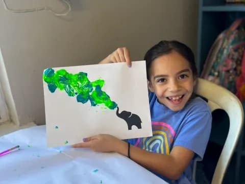 a boy sitting at a table