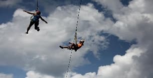 a couple of people skydiving