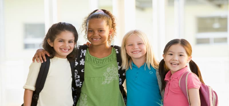 a group of girls smiling