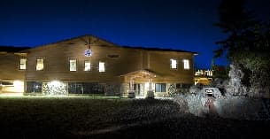 a house with lights on at night