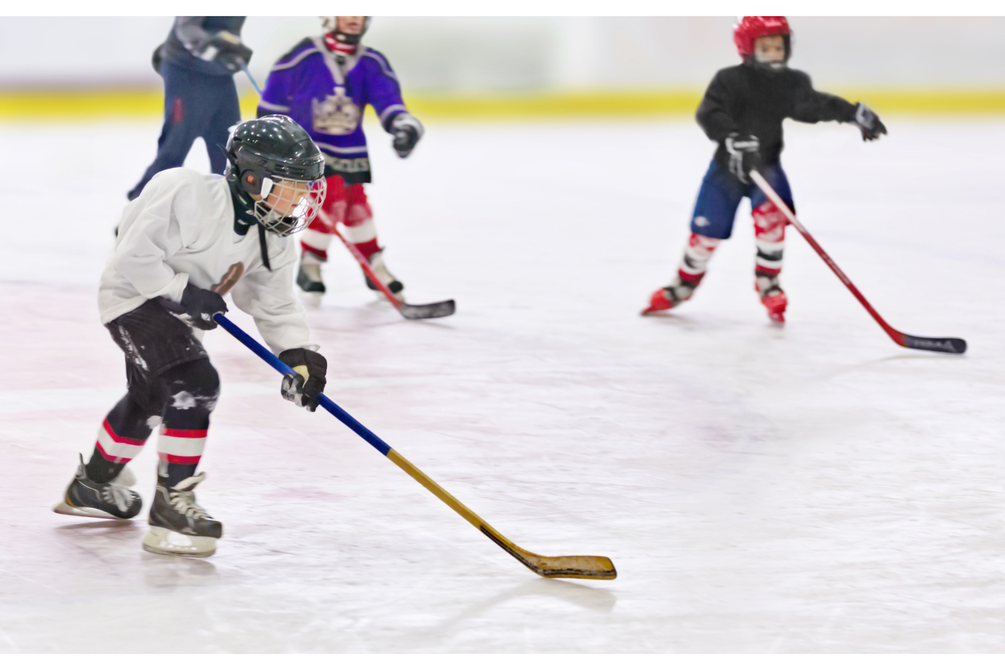 a group of people playing hockey