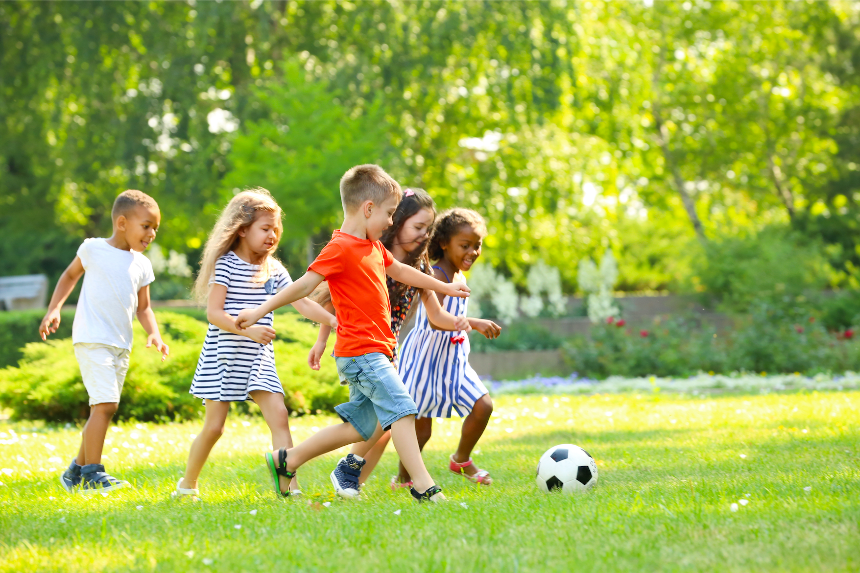 a group of kids playing football