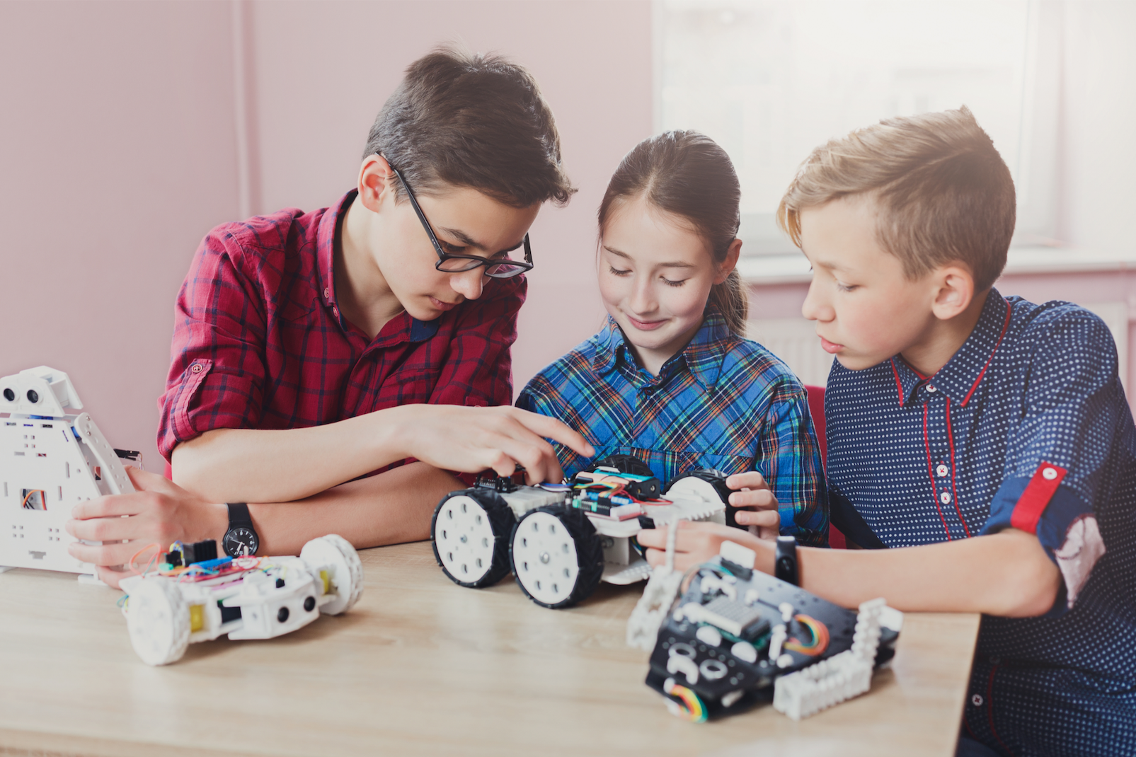a person and two children playing with toys