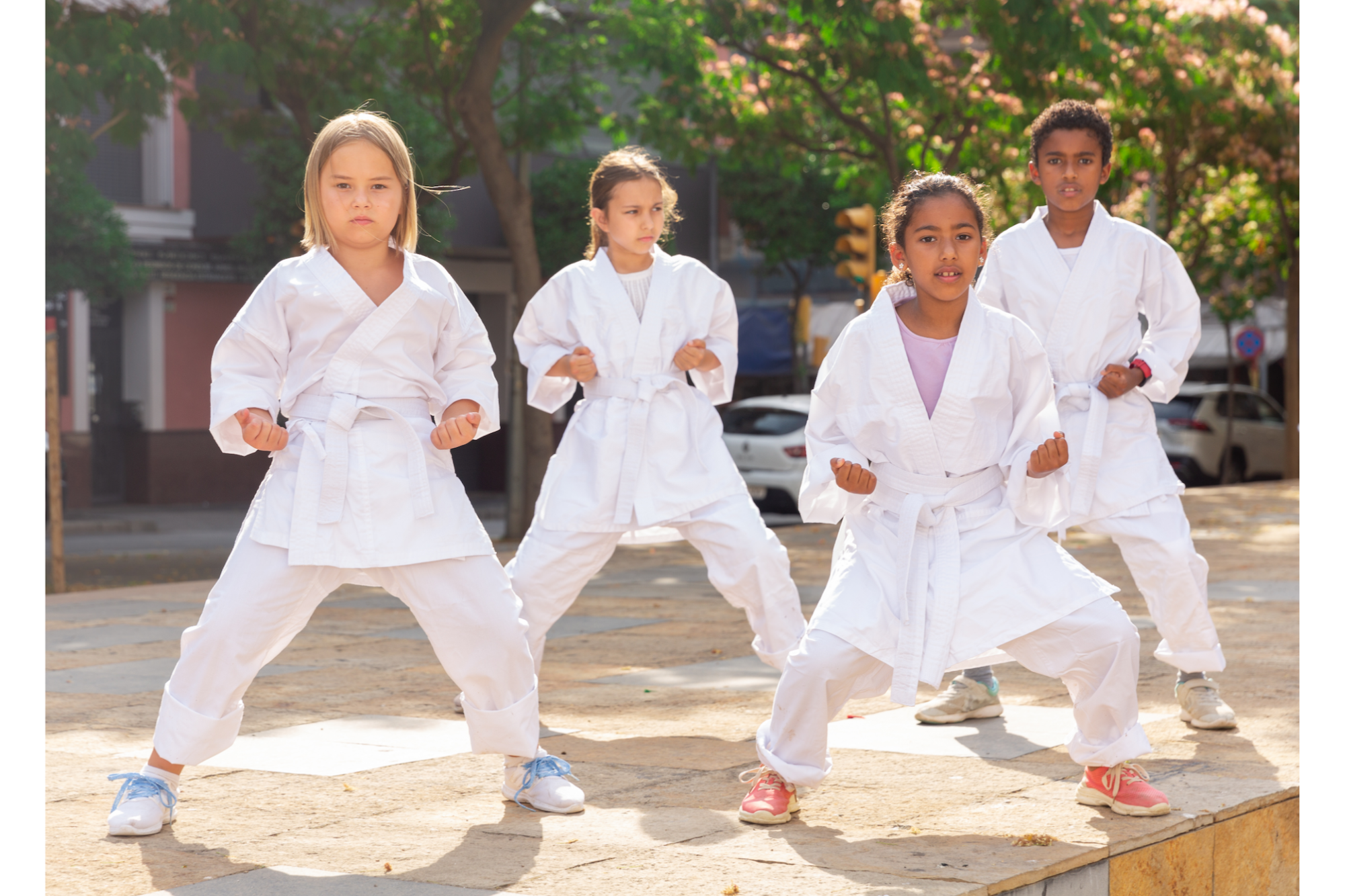 a group of people wearing white outfits