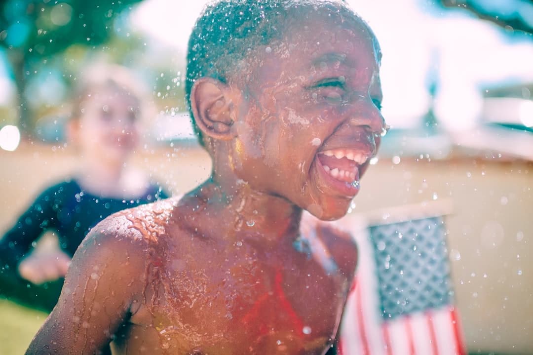 topless boy smiling