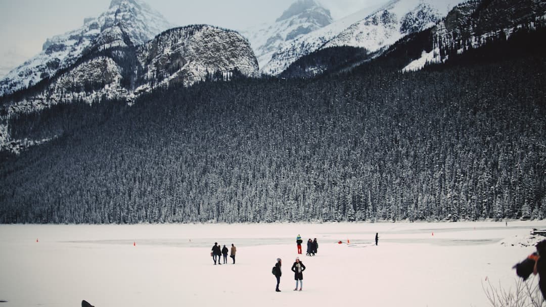 people standing on snow