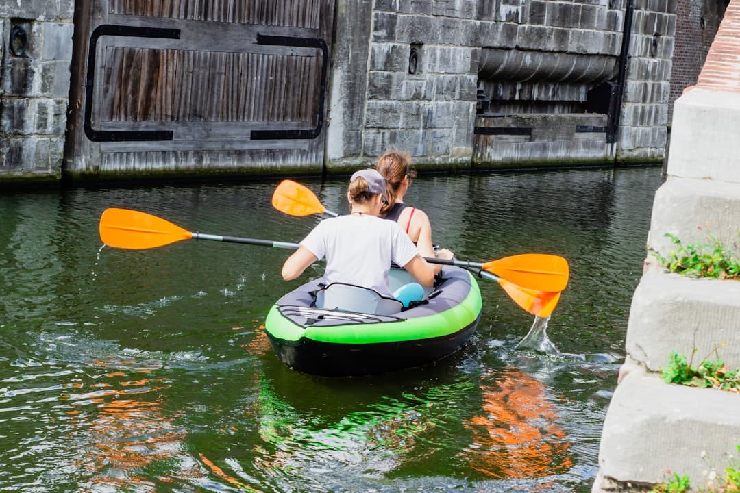 two persons riding on boat