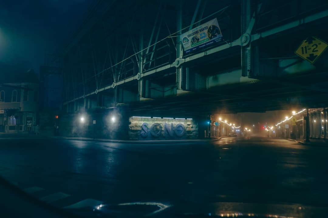 a bus driving down a street at night