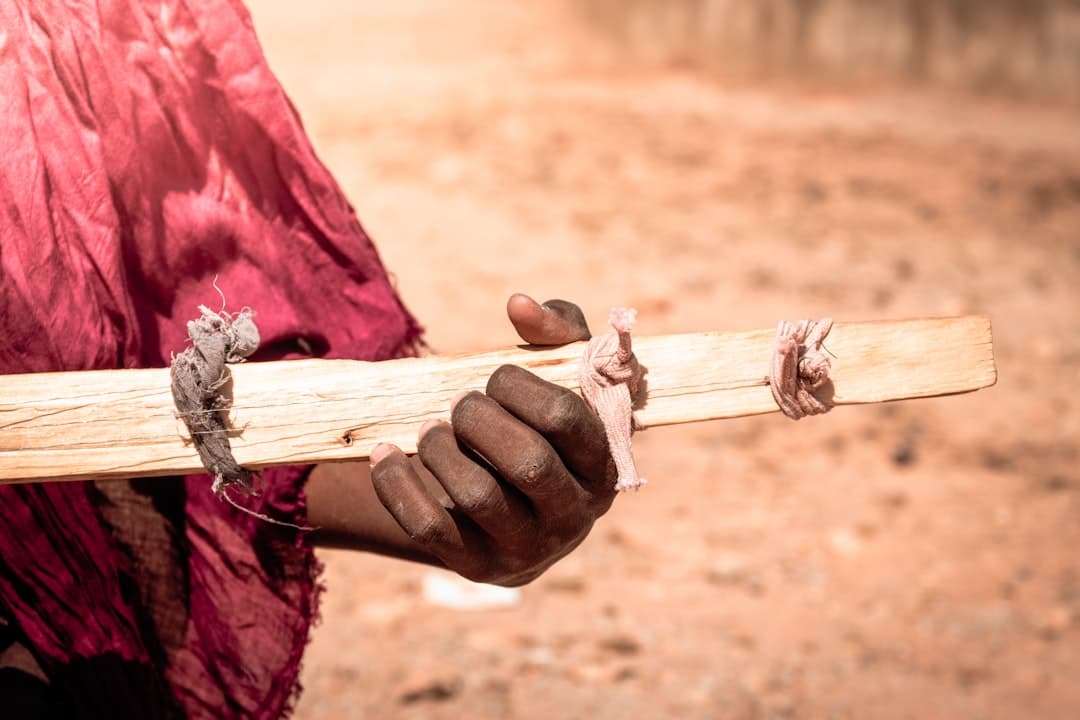 a person holding a wooden cross