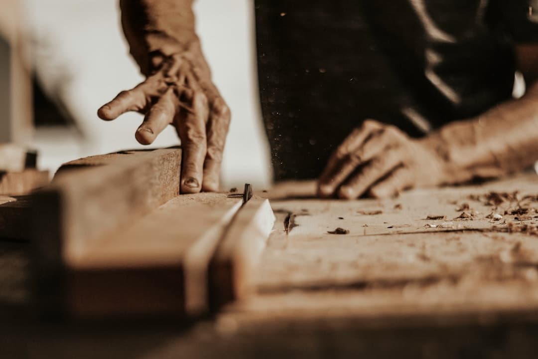 a person is working on a piece of wood