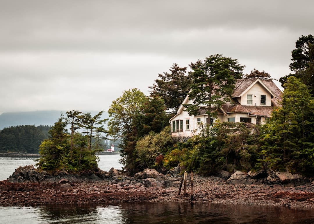 a house sitting on top of a small island