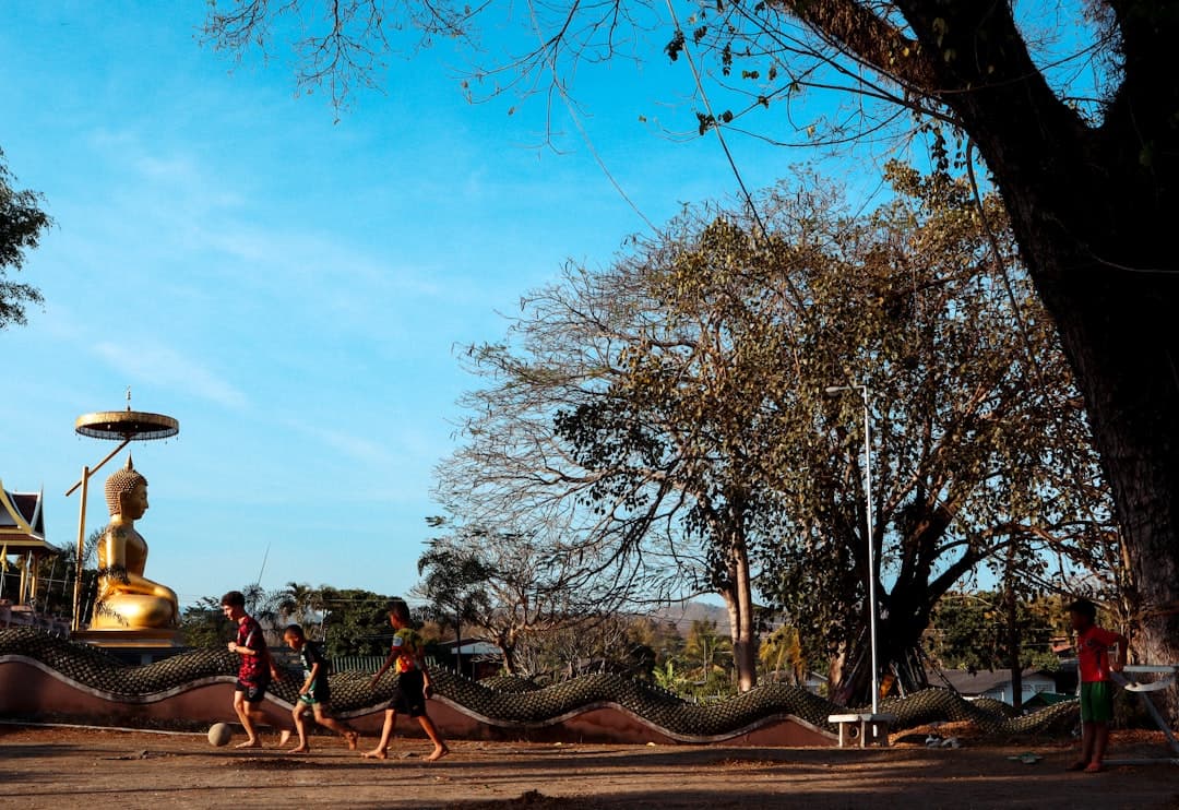 A group of people walking down a street