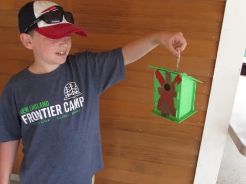 a boy painting a picture