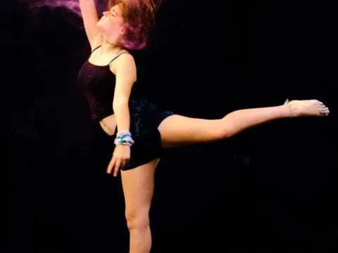 a woman dancing on a stage