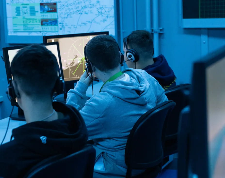 a few men wearing headsets