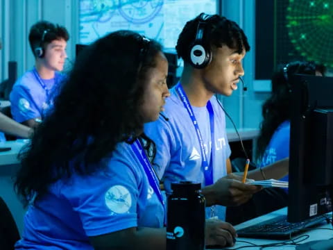 a few people wearing headsets