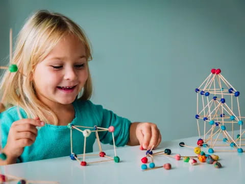 a girl playing with toys