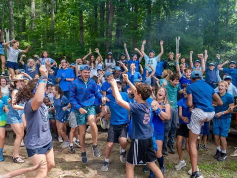 a group of people in blue shirts