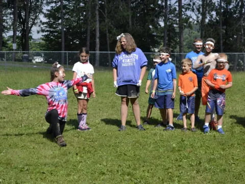 a group of children running on a field