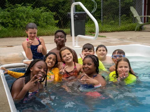 a group of children in a pool