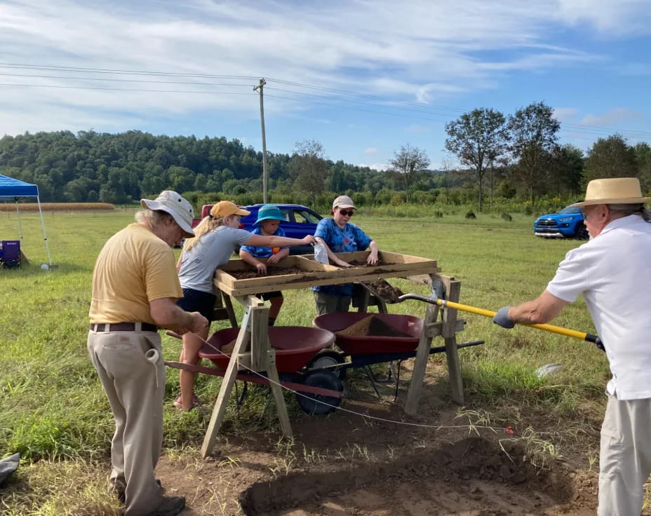 a group of people working outside