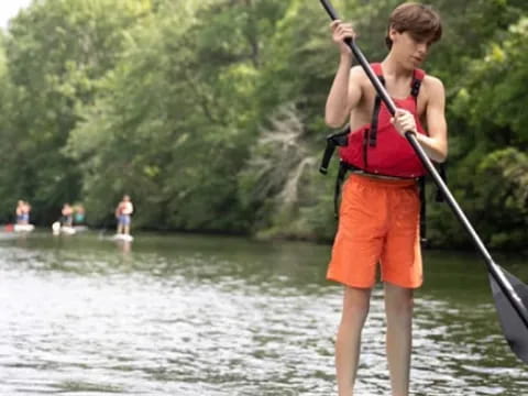 a man on a paddle board