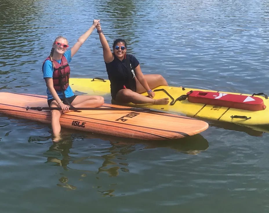 a man and woman in a canoe