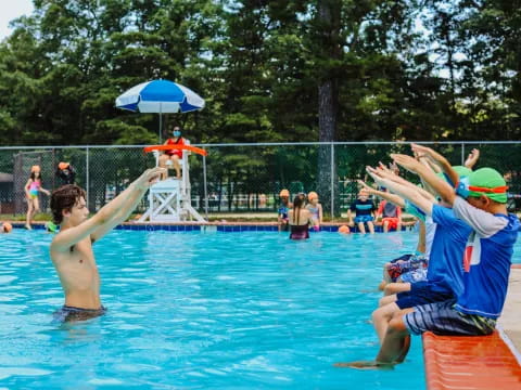 a group of people in a pool