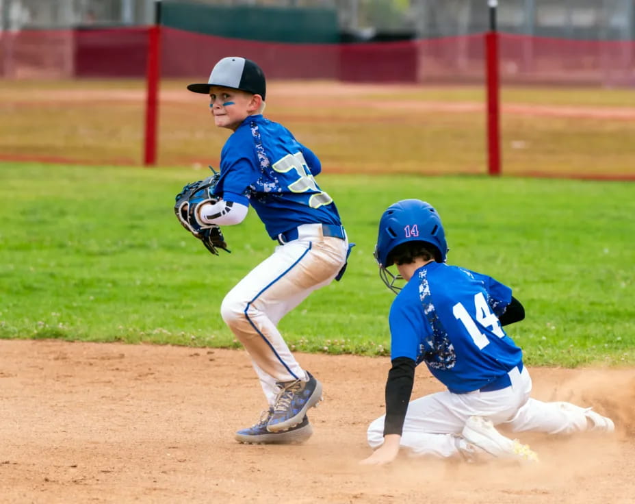 a couple of kids playing baseball