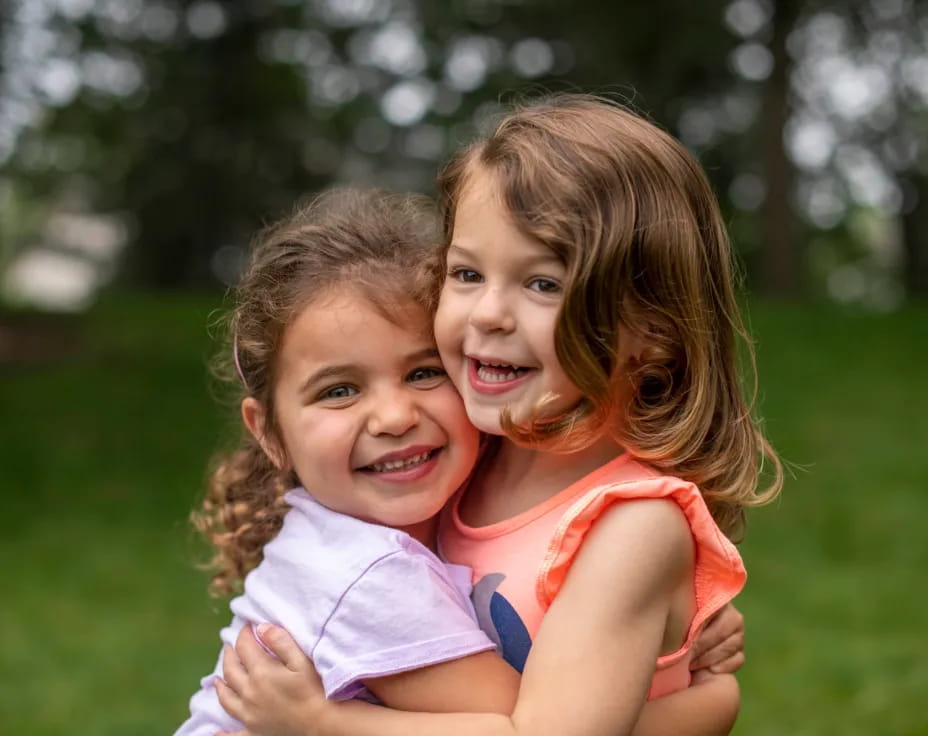 a couple of girls hugging