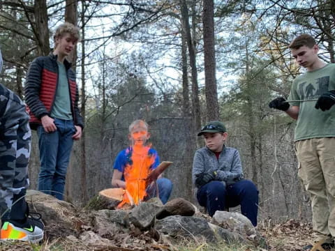 a group of people around a fire