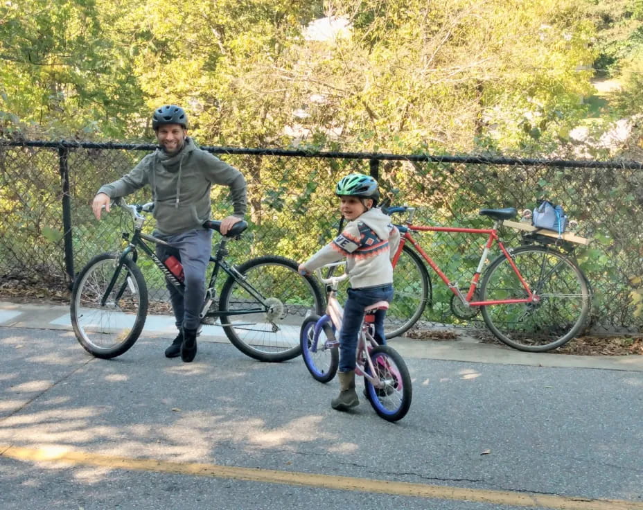 a person and a boy on bicycles