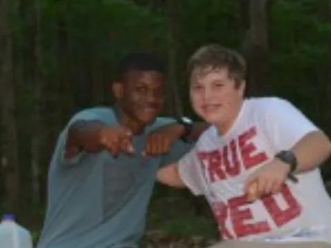 a person holding a boy